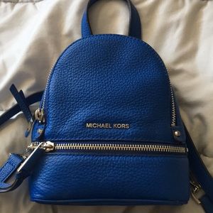 Michael Kors blue mini backpack purse.